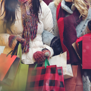 People shopping while wearing winter coats